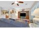 Comfortable living room features a stylish ceiling fan and flows into other areas of the home for easy access at 2091 Waterton Rivers Dr, Henderson, NV 89044