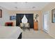 Comfortable main bedroom area with a seating area, large window, and tasteful decor at 2091 Waterton Rivers Dr, Henderson, NV 89044