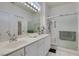 Bright bathroom features double sinks, a large mirror, and a glass-enclosed shower at 2180 Tiger Links Dr, Henderson, NV 89012