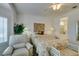 Relaxing bedroom with a bay window, chair and view into attached bathroom at 2180 Tiger Links Dr, Henderson, NV 89012