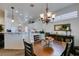 Cozy dining room featuring a wood table set and ornate chandelier lighting at 2180 Tiger Links Dr, Henderson, NV 89012