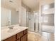 Bathroom featuring a shower with glass doors and a single sink vanity at 224 Pioneers Peak Ave, Henderson, NV 89002