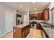 Well-lit kitchen features stainless steel appliances, granite countertops, and an island at 224 Pioneers Peak Ave, Henderson, NV 89002