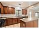 Bright kitchen showcases granite countertops, an island, tile floors, and modern appliances at 224 Pioneers Peak Ave, Henderson, NV 89002