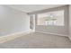 Open-concept living area with tile flooring, neutral walls, and a view of the staircase at 224 Pioneers Peak Ave, Henderson, NV 89002