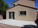 View of the house exterior showcasing a concrete patio and access through sliding glass doors at 2381 Lilac Cove St, Las Vegas, NV 89135