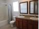 Bathroom features double sinks, a granite countertop, and shower-tub combination at 2381 Lilac Cove St, Las Vegas, NV 89135