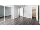 Neutral bedroom features wood floors, closet access, and bright white trim at 2451 N Rainbow Blvd # 1016, Las Vegas, NV 89108