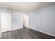 Empty bedroom featuring fresh paint, wood floors and dual closet doors at 2451 N Rainbow Blvd # 1016, Las Vegas, NV 89108
