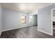 An airy bedroom with light blue walls, wood floors, and mirrored closet doors at 2451 N Rainbow Blvd # 1016, Las Vegas, NV 89108