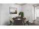 Cozy dining area features a round table with seating for four and a decorative painting at 2451 N Rainbow Blvd # 1016, Las Vegas, NV 89108