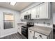 Efficient kitchen featuring stainless steel appliances, granite countertops, and ample white cabinets for stylish functionality at 2451 N Rainbow Blvd # 1016, Las Vegas, NV 89108