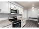 Well-lit kitchen with white cabinets, stainless steel appliances, and modern countertop at 2451 N Rainbow Blvd # 1016, Las Vegas, NV 89108