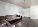 Bright living room featuring modern gray flooring and a cozy sectional sofa at 2451 N Rainbow Blvd # 1016, Las Vegas, NV 89108