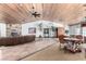 Brightly lit community lounge features ample seating, wood ceiling, and a fireplace at 2451 N Rainbow Blvd # 1016, Las Vegas, NV 89108
