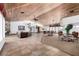 Community lounge features wood ceiling, tile flooring, and abundant seating at 2451 N Rainbow Blvd # 1016, Las Vegas, NV 89108