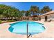 Refreshing community pool with comfortable lounge chairs, palm trees and shade at 2451 N Rainbow Blvd # 1016, Las Vegas, NV 89108