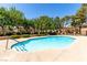 Enjoy a refreshing swim in the community pool surrounded by lush trees and landscaping at 2451 N Rainbow Blvd # 1016, Las Vegas, NV 89108