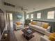 Comfortable living room with neutral furniture, bright yellow pillows, and a stylish coffee table at 258 Bella Matese Ave, Las Vegas, NV 89183