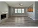 Open living room with a fireplace and plenty of natural light at 258 Bella Matese Ave, Las Vegas, NV 89183