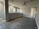 Bright upper living room with plank flooring, neutral gray walls, and bright natural light at 258 Bella Matese Ave, Las Vegas, NV 89183