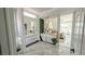 Spa-like primary bathroom featuring a luxurious soaking tub and access to the main bedroom at 2652 Golfside Dr, Las Vegas, NV 89134