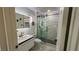 Modern bathroom featuring a glass shower, marble floors, and a sleek gold faucet at 2652 Golfside Dr, Las Vegas, NV 89134