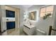 Modern half-bathroom, featuring a stylish vanity and sleek design, complemented by chic fixtures at 2652 Golfside Dr, Las Vegas, NV 89134