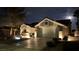 Well-maintained home featuring a two-car garage, neutral-colored exterior, and a manicured lawn with landscape lighting at 2652 Golfside Dr, Las Vegas, NV 89134