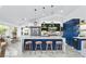 Stunning kitchen with blue cabinets, marble floors, stainless steel appliances, and large island perfect for entertaining at 2652 Golfside Dr, Las Vegas, NV 89134