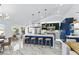 Spacious kitchen featuring a large center island, stylish pendant lights, and stainless steel appliances at 2652 Golfside Dr, Las Vegas, NV 89134