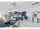 Bright, open kitchen featuring a large island with bar stools, stainless steel appliances, and stylish lighting at 2652 Golfside Dr, Las Vegas, NV 89134