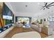 The living room boasts a modern interior with a custom media center and seamless indoor-outdoor living at 2652 Golfside Dr, Las Vegas, NV 89134