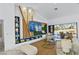 Bright living room features a large screen TV, custom shelving, and expansive glass doors to the exterior at 2652 Golfside Dr, Las Vegas, NV 89134