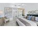 Spacious primary bedroom features a modern entertainment console and an ensuite bathroom at 2652 Golfside Dr, Las Vegas, NV 89134