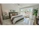 Cozy main bedroom showcasing ample natural light from the bay window and stylish decor at 2652 Golfside Dr, Las Vegas, NV 89134