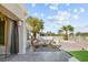 Relaxing backyard patio featuring comfortable seating, fire pit, and lush landscaping at 2652 Golfside Dr, Las Vegas, NV 89134