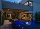 Backyard featuring a modern pool, covered patio, spiral staircase, and stunning architectural details at 2655 Juniper Branch St, Las Vegas, NV 89117