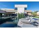 Contemporary house showcasing an infinity pool, outdoor lounge area, and sleek design, perfect for luxury outdoor living at 2655 Juniper Branch St, Las Vegas, NV 89117