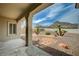 Backyard featuring a covered patio with views of the desert landscape and surrounding mountains at 2721 Faiss Dr, Las Vegas, NV 89134