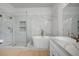 Primary bathroom with soaking tub, glass enclosed shower and dual sink vanity at 2721 Faiss Dr, Las Vegas, NV 89134