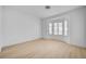 Bright bedroom featuring wood-look floors and a bay window with custom shutters at 2721 Faiss Dr, Las Vegas, NV 89134