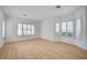 Bright bedroom with wood floors and multiple windows with plantation shutters at 2721 Faiss Dr, Las Vegas, NV 89134