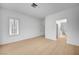 Spacious bedroom features plantation shutters, light colored laminate floors and a door leading to the bathroom at 2721 Faiss Dr, Las Vegas, NV 89134