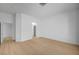 Open bedroom with light colored laminate floors and door leading to a walk-in closet at 2721 Faiss Dr, Las Vegas, NV 89134