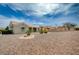 Attractive single-story home with desert landscaping featuring palm trees and a well-manicured yard at 2721 Faiss Dr, Las Vegas, NV 89134