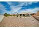 Spacious one-story home with desert landscaping, gravel, palm trees, and a well-kept exterior at 2721 Faiss Dr, Las Vegas, NV 89134