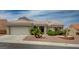 Charming single-story home featuring a tile roof, desert landscaping, and an attached two-car garage at 2721 Faiss Dr, Las Vegas, NV 89134