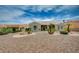 Well-maintained single-story home with desert landscaping featuring palm trees and decorative gravel at 2721 Faiss Dr, Las Vegas, NV 89134