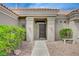 Inviting front entrance with a stone walkway, desert landscaping and a charming bench at 2721 Faiss Dr, Las Vegas, NV 89134
